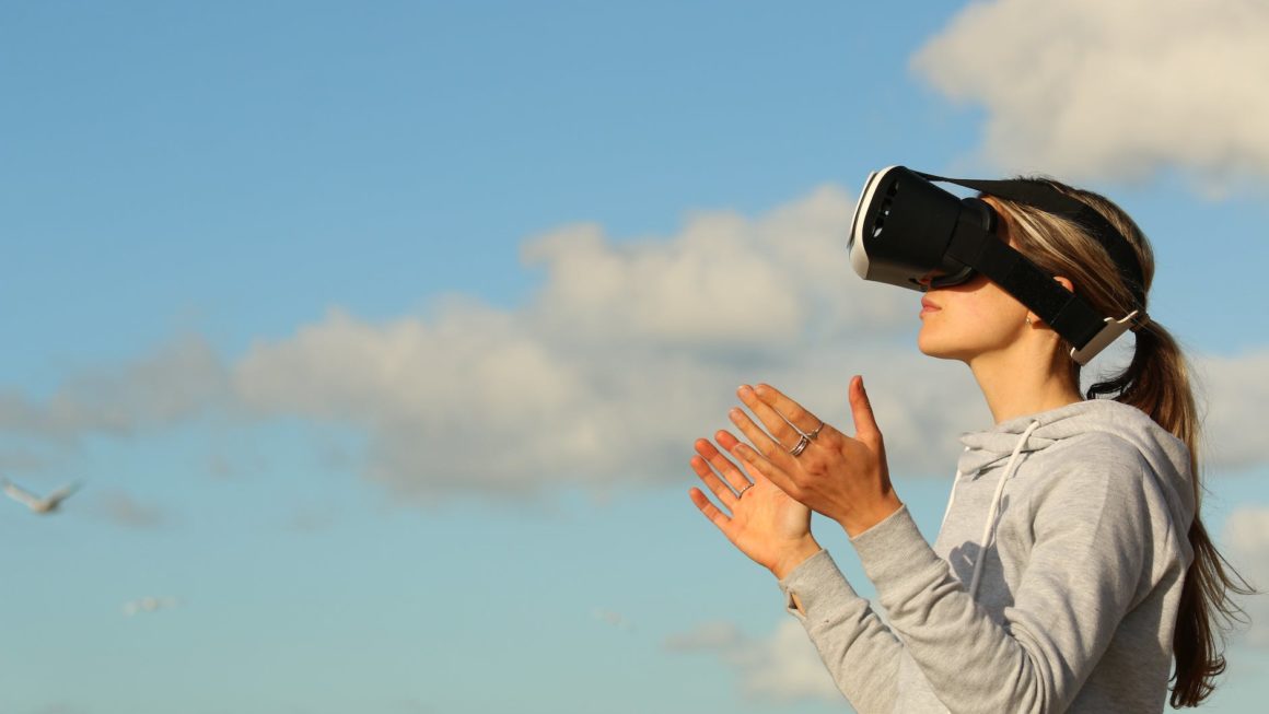 woman using vr goggles outdoors