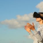 woman using vr goggles outdoors